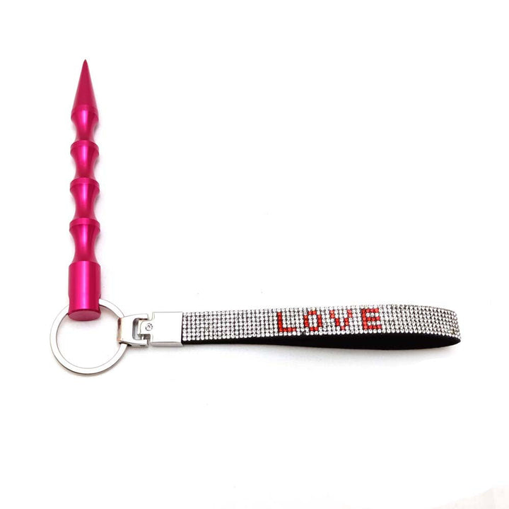 Practical yet pretty love charm keychain adorned with sparkling rhinestones.