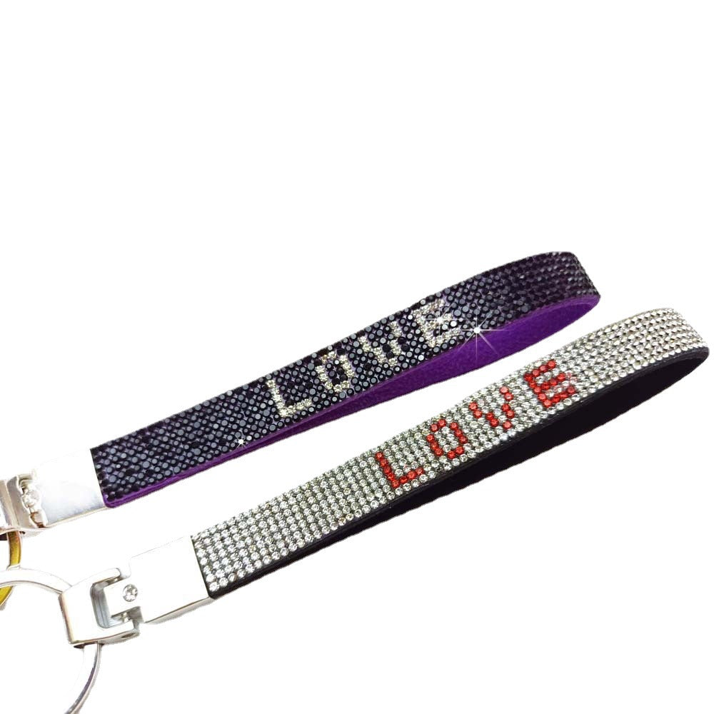 Stylish women's love charm key holder with dazzling rhinestones.