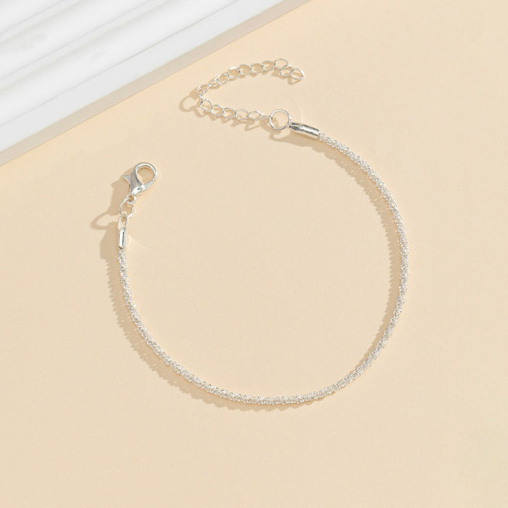 Adjustable silver crystal anklet for women, sparkling design. Comfortable and stylish foot accessory for any size.