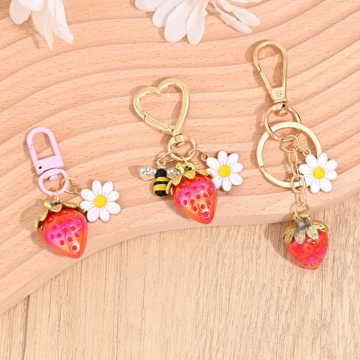 Sparkling strawberry charm keychain for women, a cute accessory.