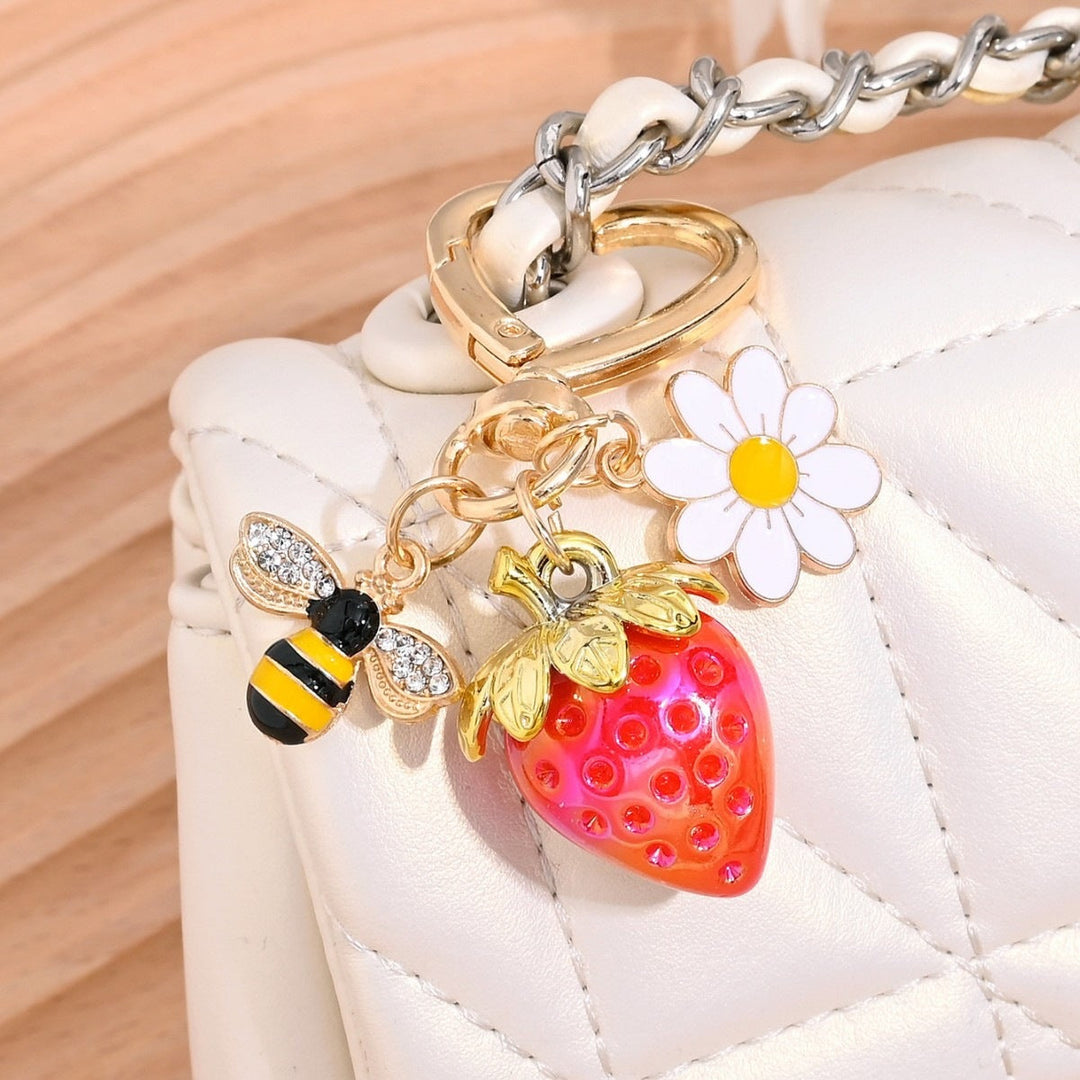Glitter strawberry key holder for bags, a vibrant gift idea.