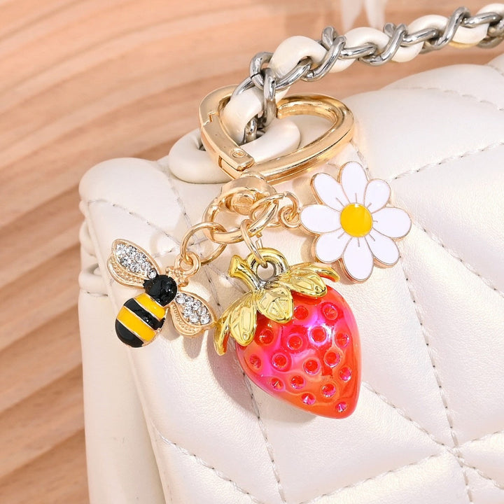 Glitter strawberry key holder for bags, a vibrant gift idea.
