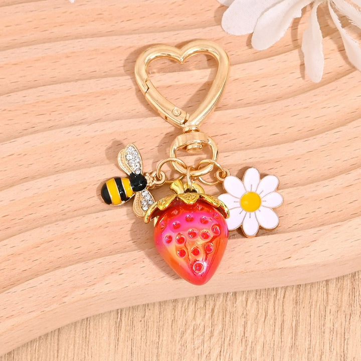 Fashion accessory sparkling strawberry keychain, for all ages.