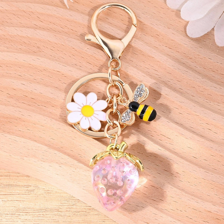 Cute fruit sparkling strawberry bag charm, playful and sweet.