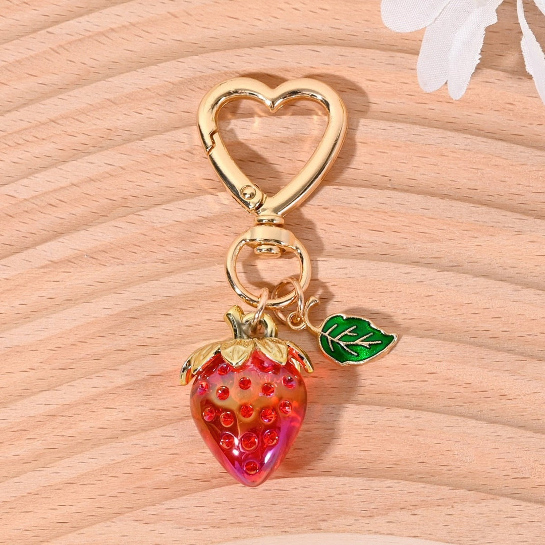 Trendy sparkling strawberry key accessory, a must-have item.