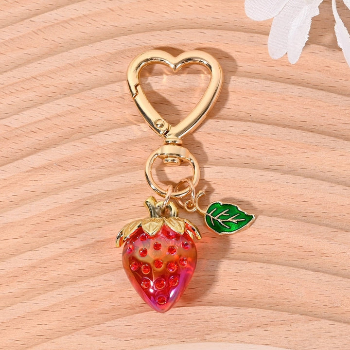 Trendy sparkling strawberry key accessory, a must-have item.