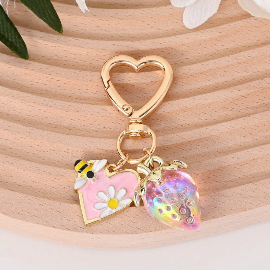 Miniature sparkling strawberry charm for keys, detailed design.
