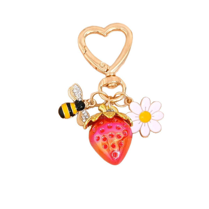 Shiny plastic strawberry charm for keys or purses, a novelty item.
