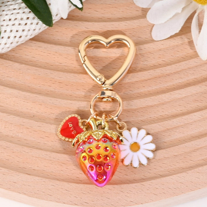 Dazzling strawberry charm keychain, adding bling to your bag.