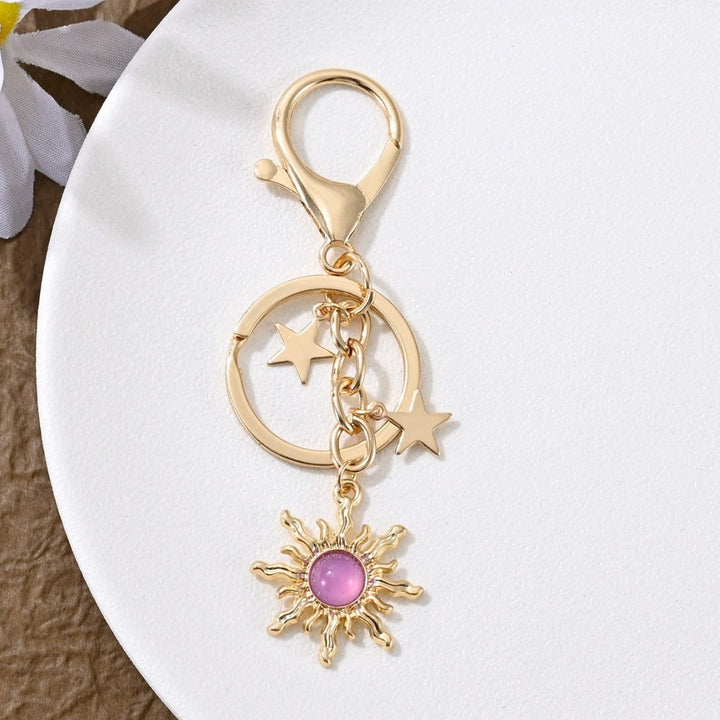 Metallic sparkling sun & star keychain, a glamorous touch for women.