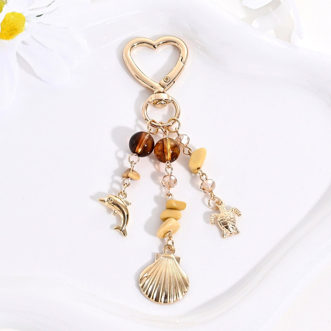 Elegant women's sparkling sun & star charm, perfect for keys or handbags.