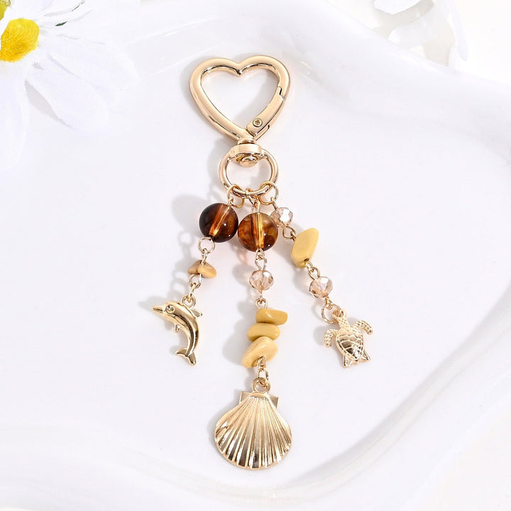 Elegant women's sparkling sun & star charm, perfect for keys or handbags.