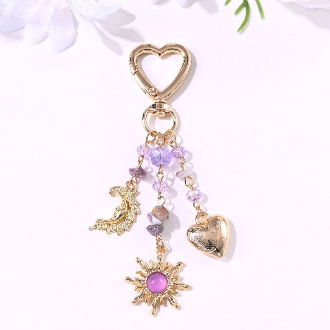 Everyday luxury: sparkling sun & star keychain for stylish women.
