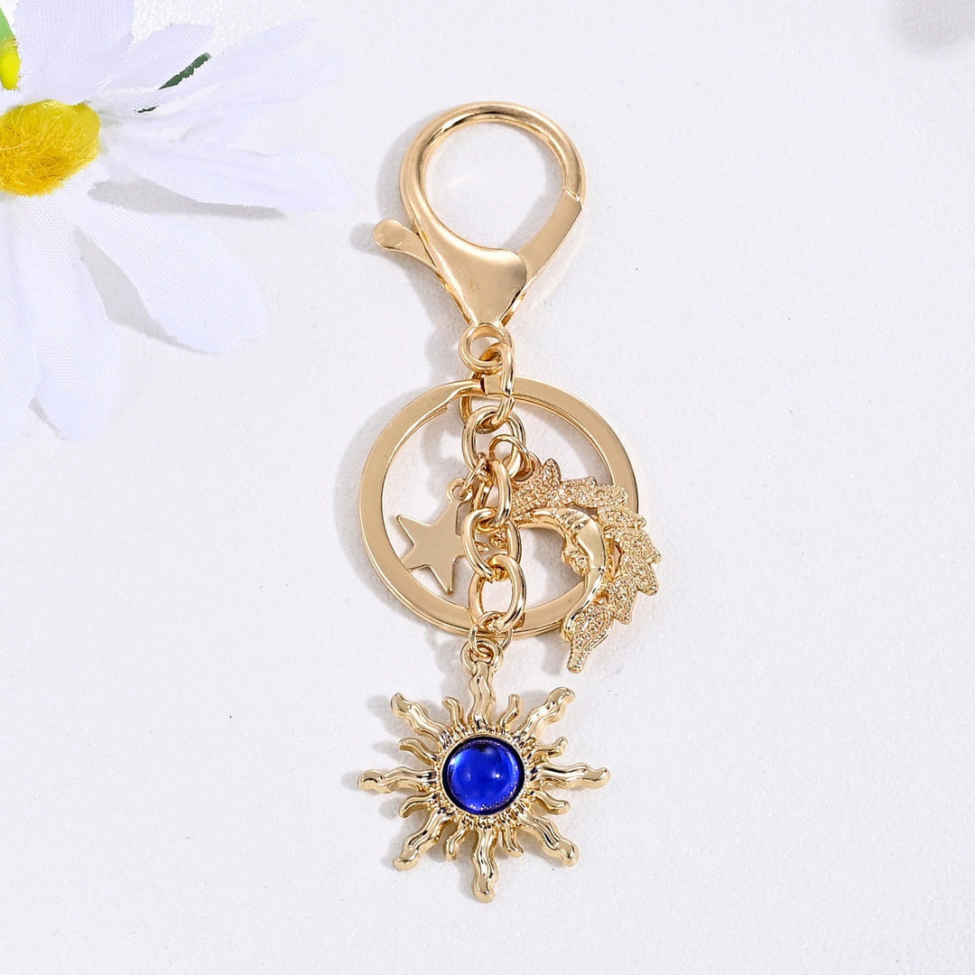 Bright sparkling sun & star women's key fob charm, a dazzling accessory.