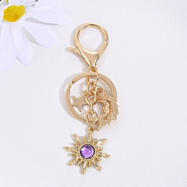 Statement sparkling sun & star bag charm for women, truly glamorous.