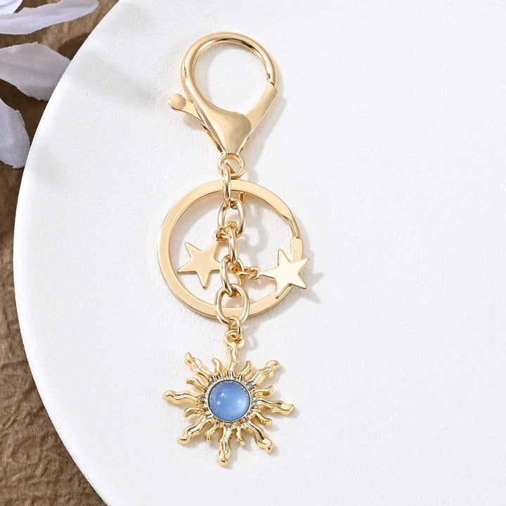 Enhance your look with this sparkling sun & star key charm for women.