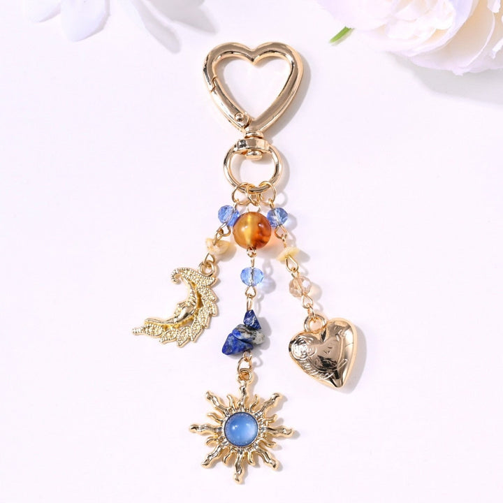 Fashion accent: sparkling sun & star key & bag charm for modern women.
