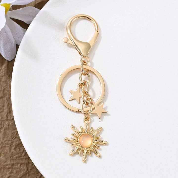 Beautifully crafted sparkling sun & star key charm for women.