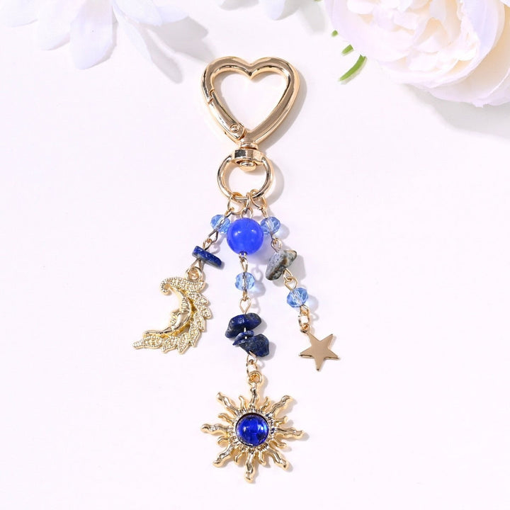 Glimmering sun and star women's keychain, adding a touch of sparkle.