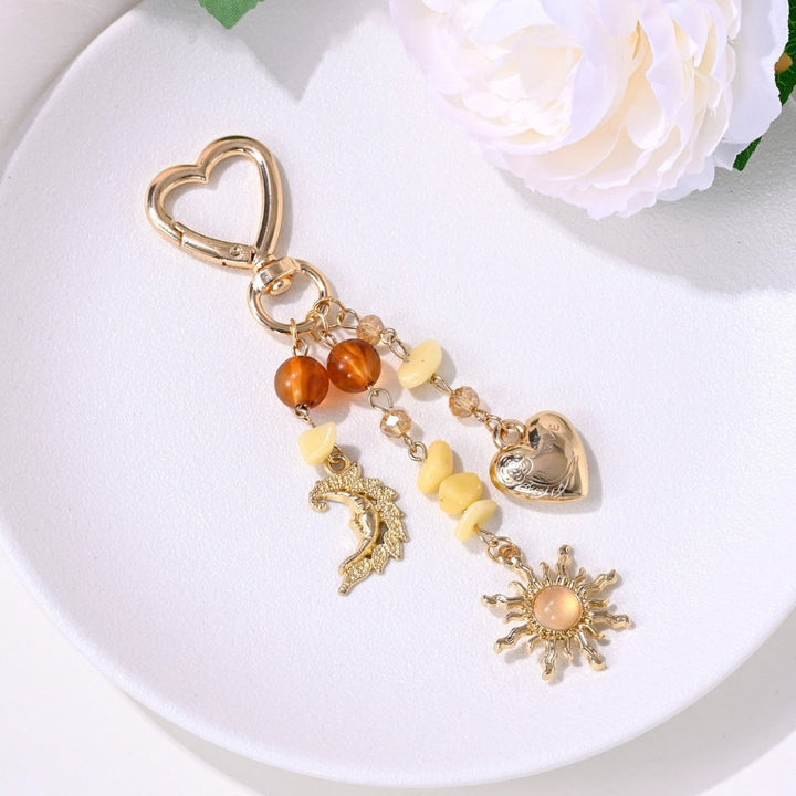 Dazzling sparkling sun & star key holder, an elegant women's accessory.