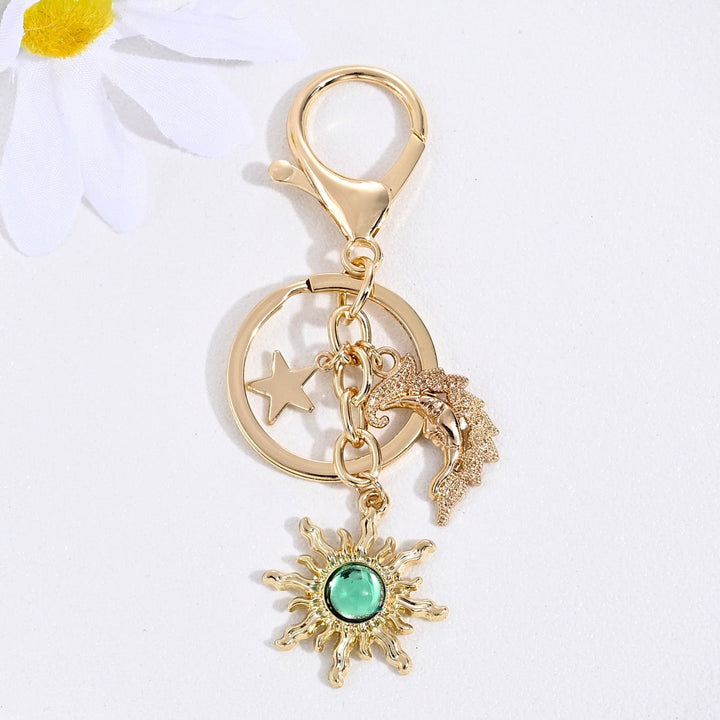 Stylish key holder charm featuring a sparkling sun & star motif for women.