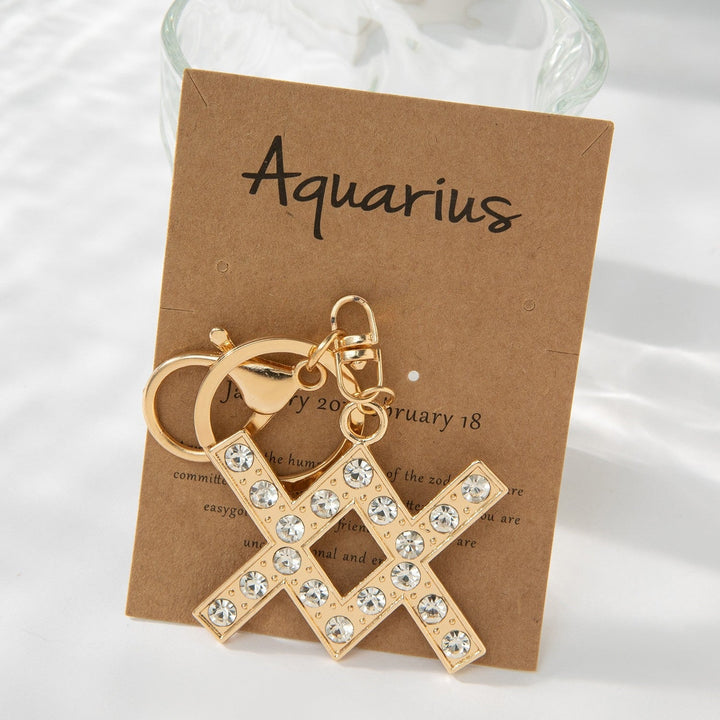 Elegant sparkling bull symbol keychain; glitter charm for astrology lovers, chic fashion accessory.