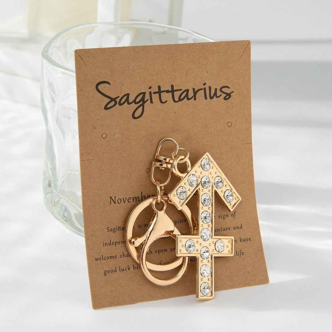 Unisex sparkling zodiac keychain; fashionable glitter charm accessory for any astrology sign.