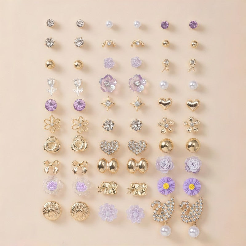 Full set of sparkling women's earrings, featuring both stud and elegant dangle designs.