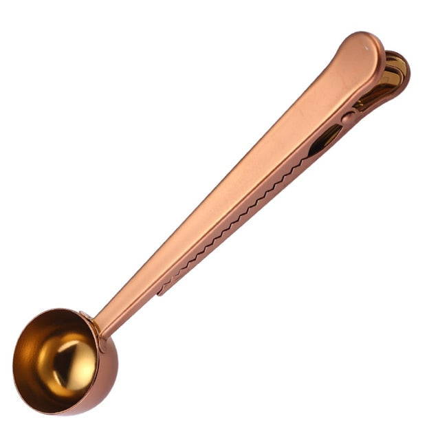 Stainless steel 2-in-1 coffee spoon and bag clip for precise scooping & freshness. Kitchen & cafe accessory.