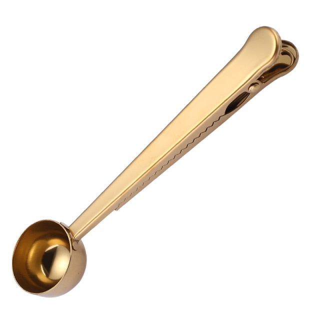 Practical coffee scoop & bag clip for kitchen organization. Keep ground coffee fresh with this stainless tool.