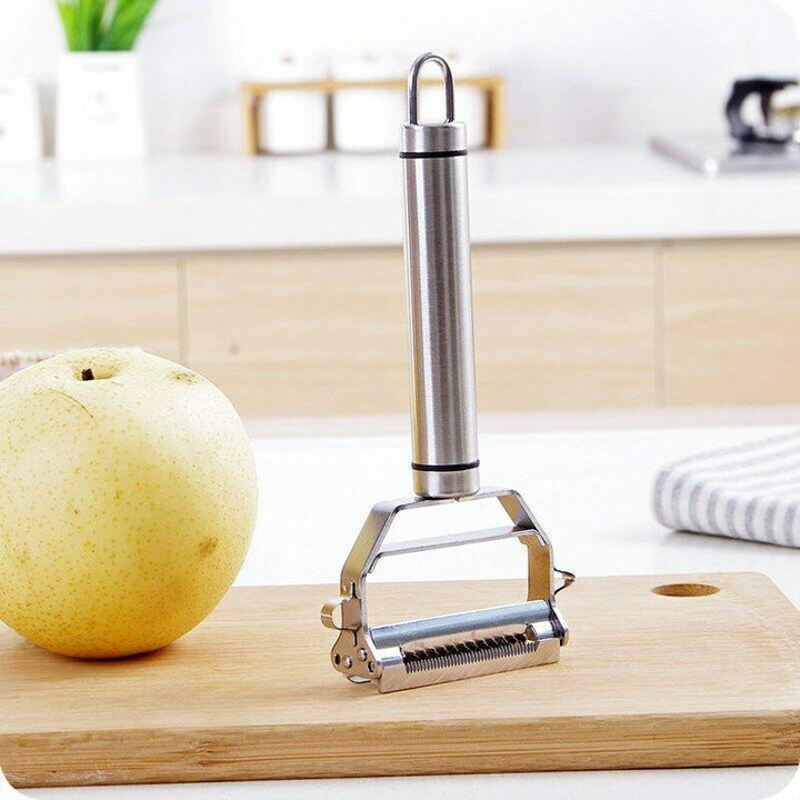 Detail view of the precise julienne blades on the stainless steel cutter, excellent for garnishes and salads.
