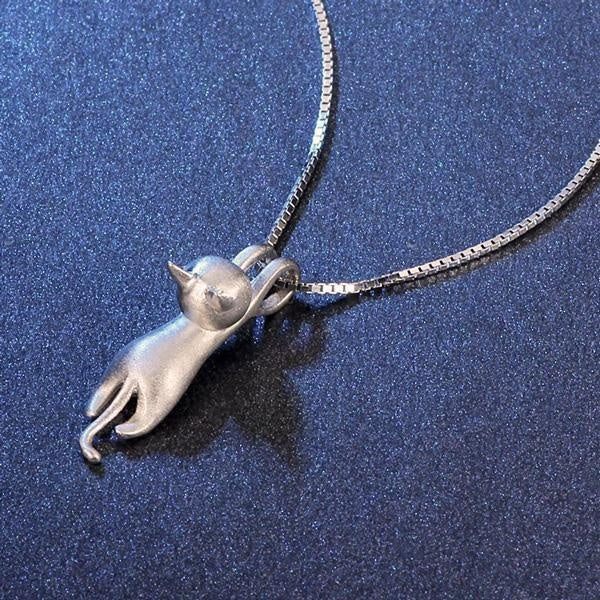 Detailed sterling silver cat pendant necklace, showcasing the elegant hanging feline design. Women's delicate jewelry.