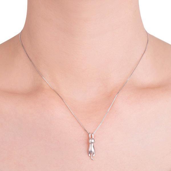 Women's sterling silver cat pendant necklace worn with an adjustable chain. Stylish animal jewelry.
