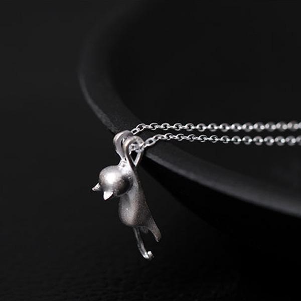 Polished sterling silver cat pendant, a charming animal necklace. Features a delicate, adjustable silver chain.
