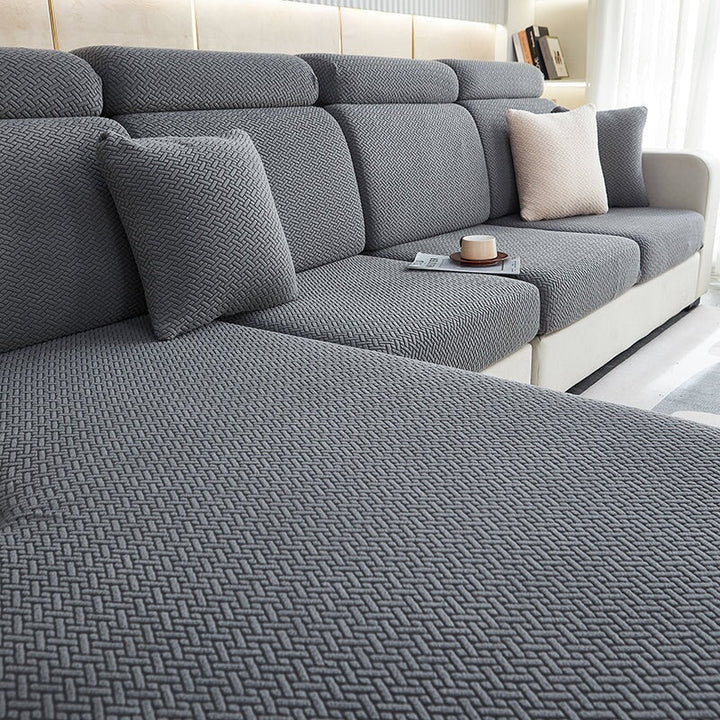 Elastic backrest cover for sectional sofa, part of a complete stretchable furniture protection set.