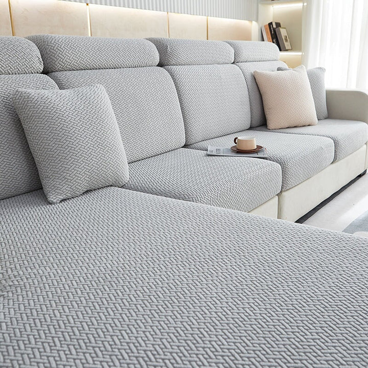 Sectional sofa protection cover, stretchable and durable for long-lasting home furniture care.