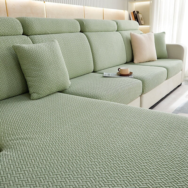 Durable stretch sofa cover with separate cushion covers for complete sectional protection.
