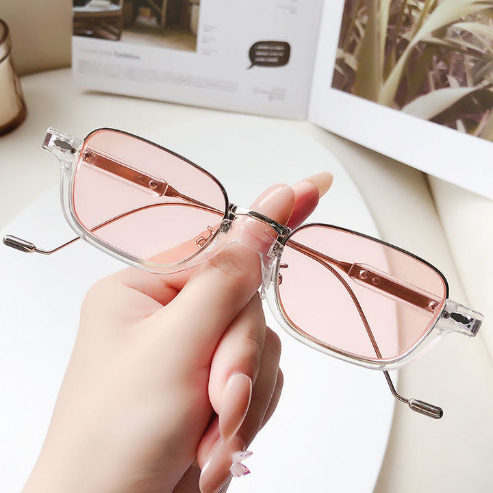 Minimalist rectangular clear lens glasses, offering sophisticated style and comfort.