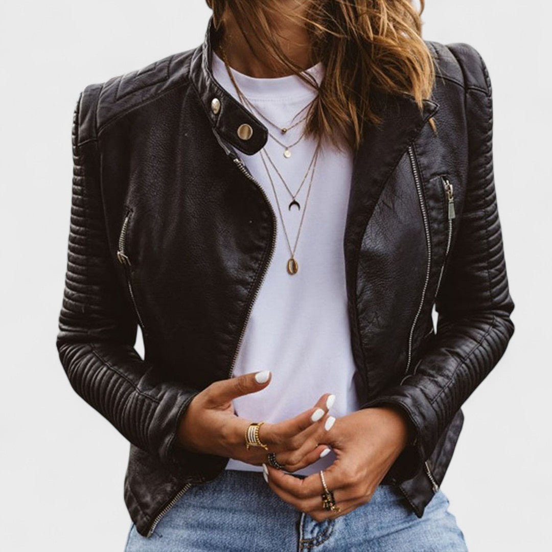 Stylish black women's zippered jacket with stand collar, accent pockets, long sleeves. Modern casual chic outerwear.