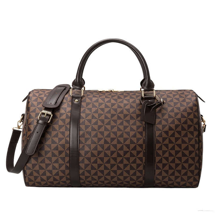 Close-up of durable leather handle and accents on men's travel duffel bag; quality luggage detail.