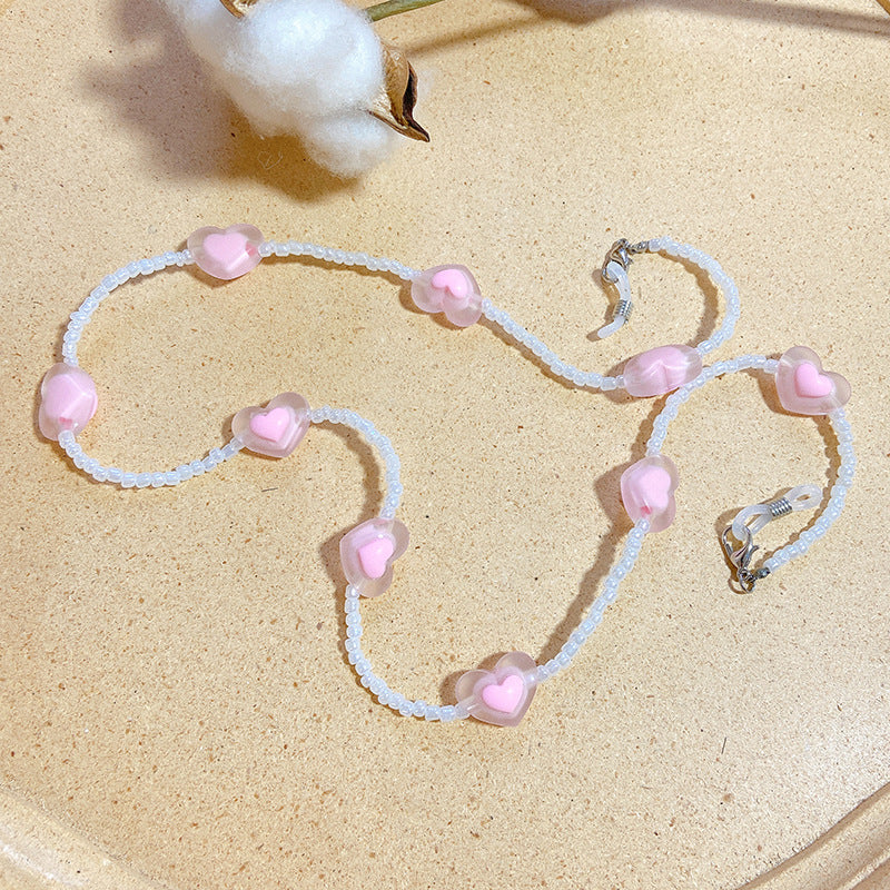 Elegant eyewear chain with sweet heart charms. This stylish glasses holder is a secure & fashionable accessory.