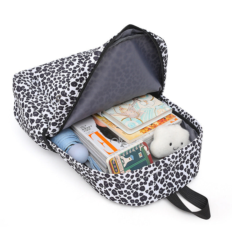 Fashionable women's leopard print backpack set, ideal for college, travel, or daily essentials.