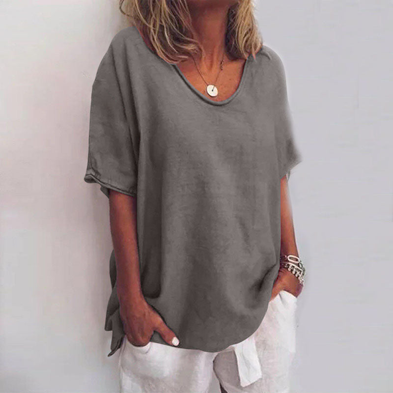 Stylish loose women's blouse offering effortless tummy coverage, perfect for versatile everyday fashion.