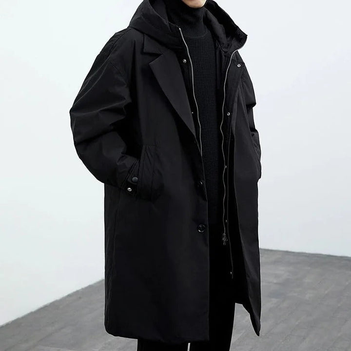 Structured men's hooded long trench coat. Classic warm outerwear for men's autumn & winter fashion, perfect for city.
