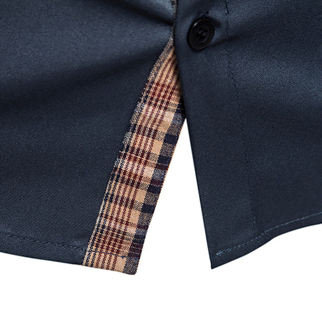 Close-up of elegant plaid pattern on men's long-sleeve dress shirt, showcasing fine detail.