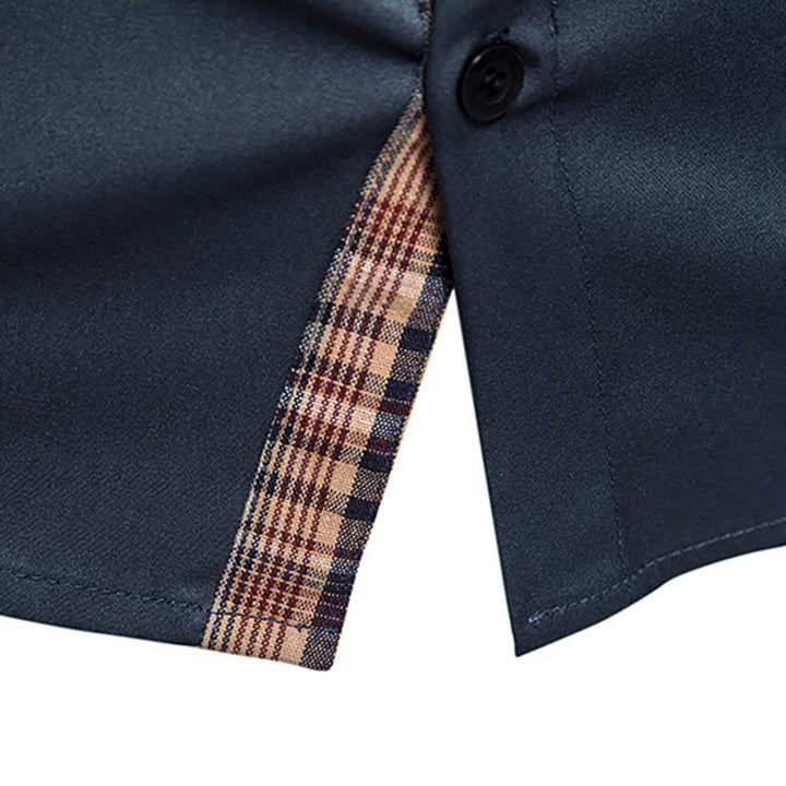 Close-up of elegant plaid pattern on men's long-sleeve dress shirt, showcasing fine detail.