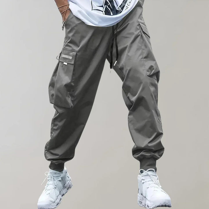 Stylish men's cargo pants in a comfortable tapered fit, perfect for casual wear & modern fashion.