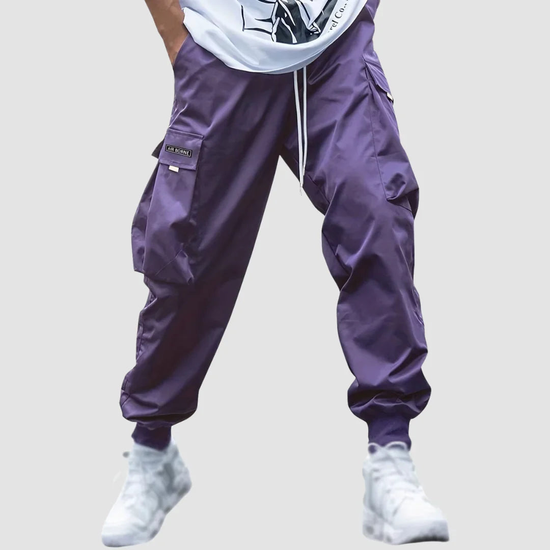 Multi-pocket men's utility cargo pants, offering practical storage for outdoor adventures or daily wear.