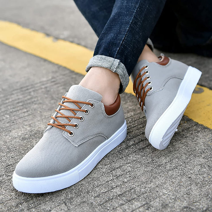 Top-down view of men's comfortable lace-up low-top sneakers with a clean design.