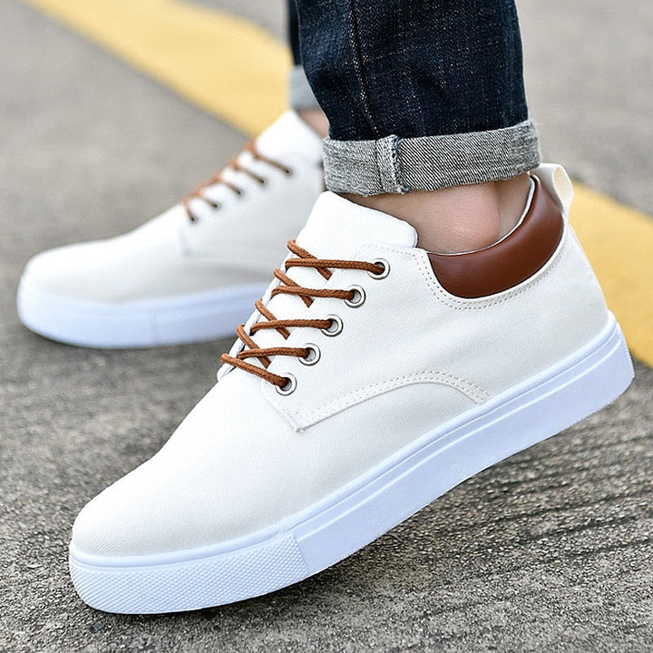 Front view of men's stylish low-top sneakers with durable lace-up closure for comfort.